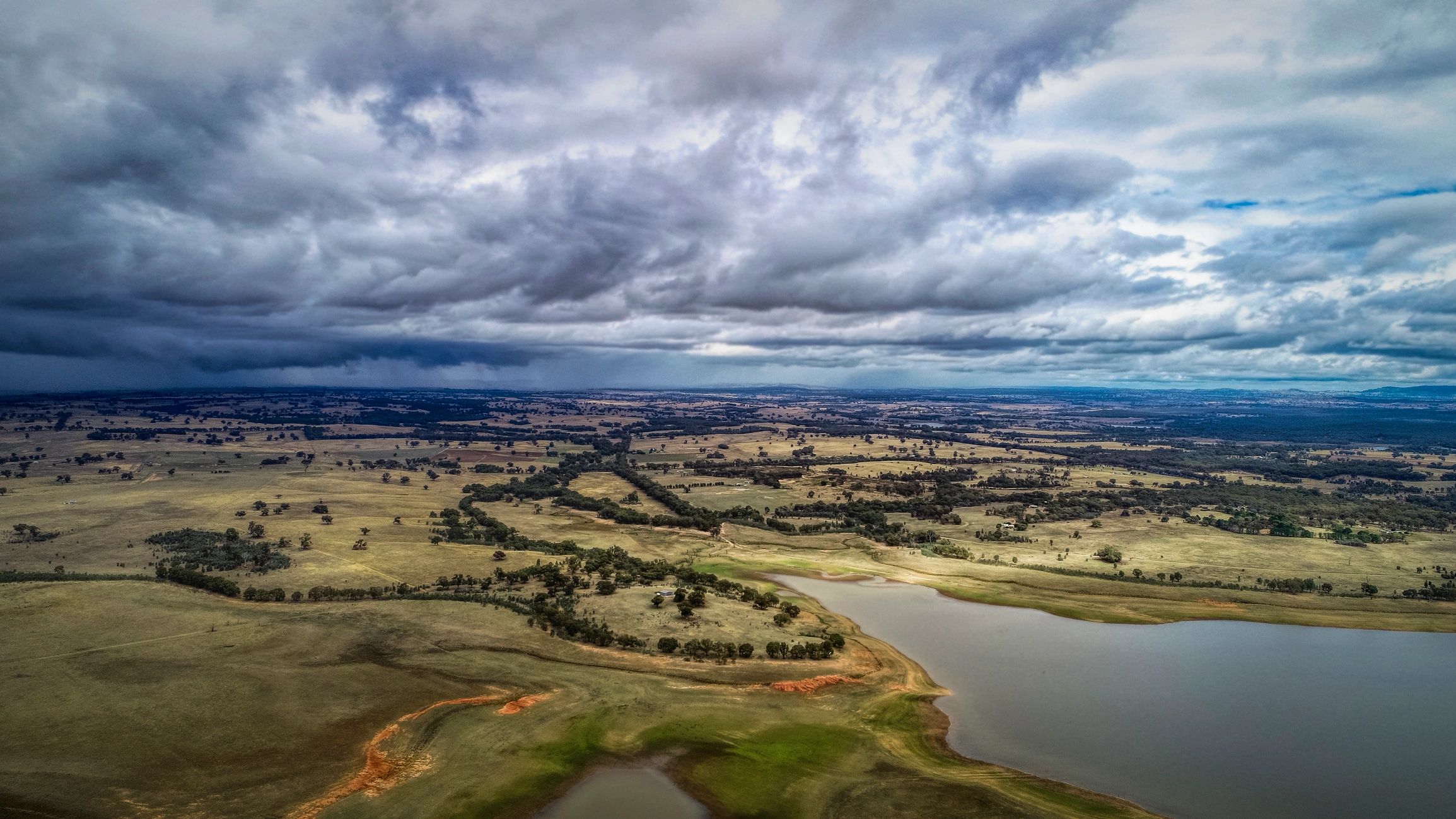 Aerial view of rural Australian farmland and water